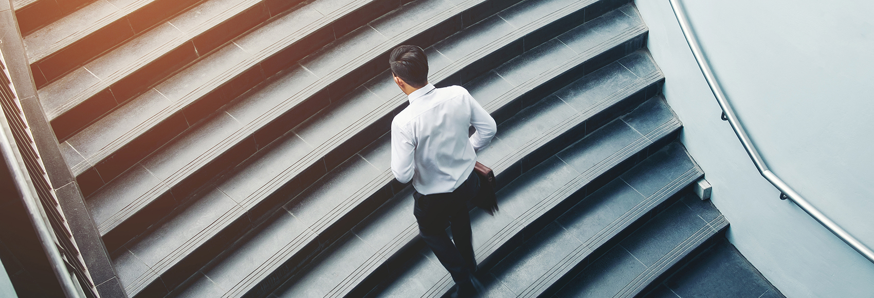 Businessman running fast upstairs